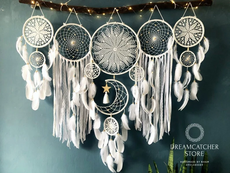 Dreamcatcher moon and stars hanging over the bed
